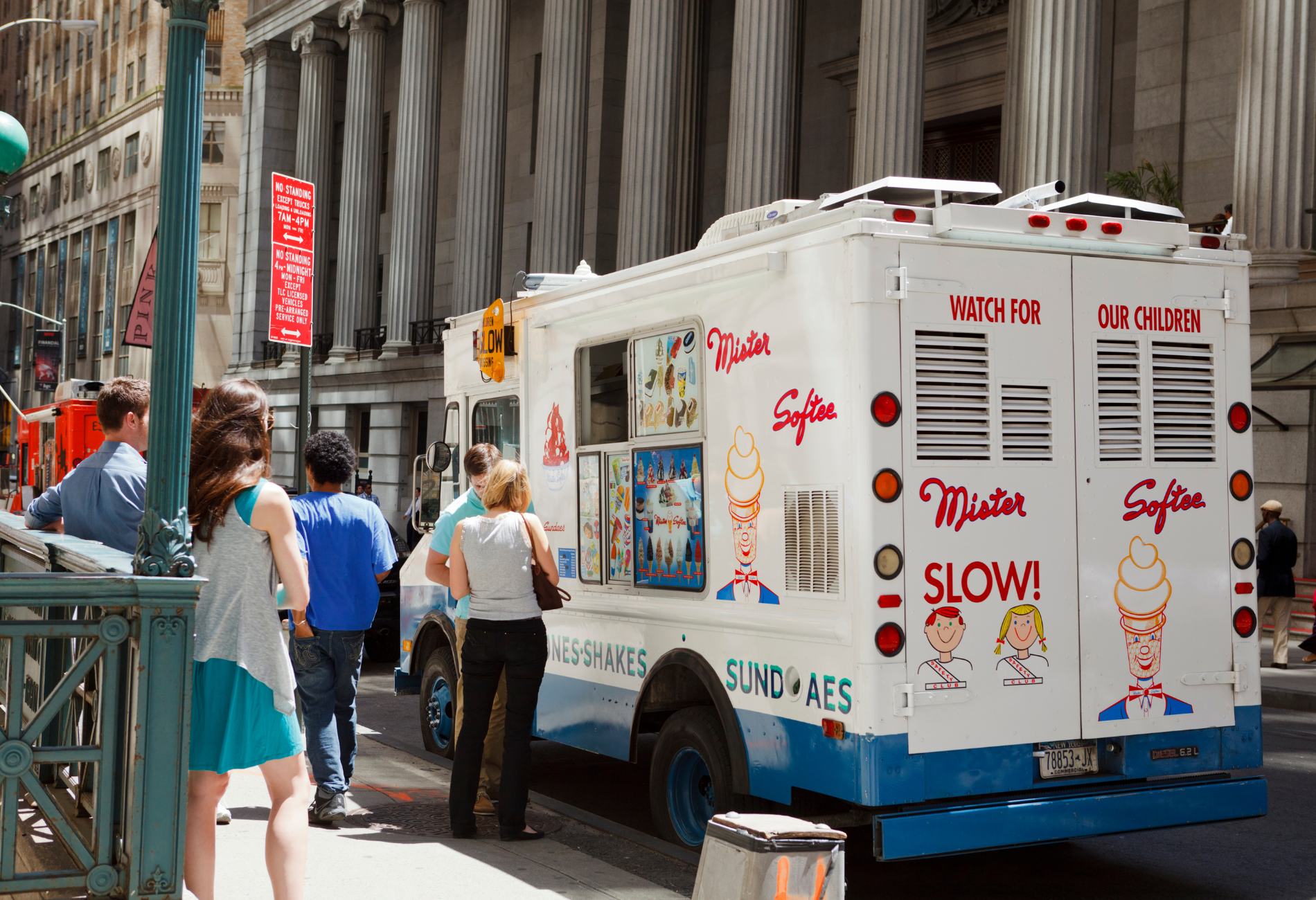 people wait in line at a Mister Softee ice cream truck in New York City