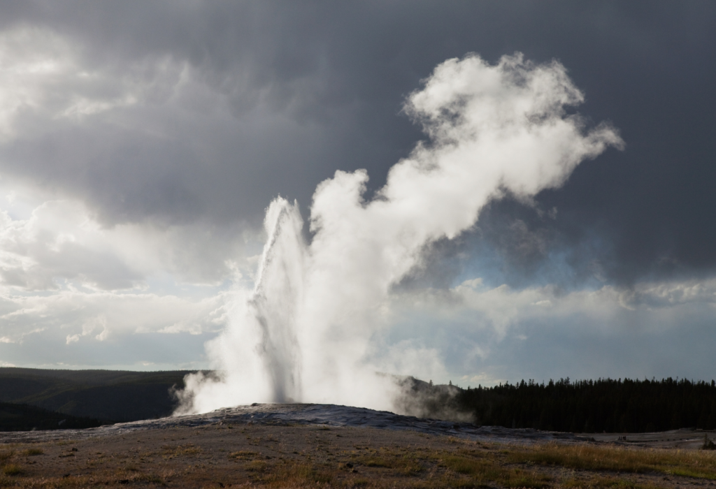 Old faithful geyser erupting yellowstone
