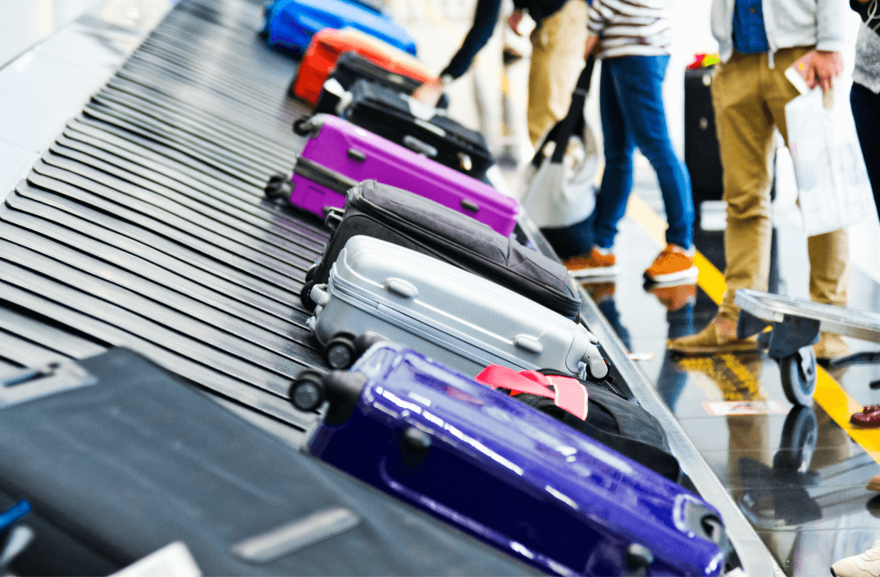 luggage on baggage claim carousel