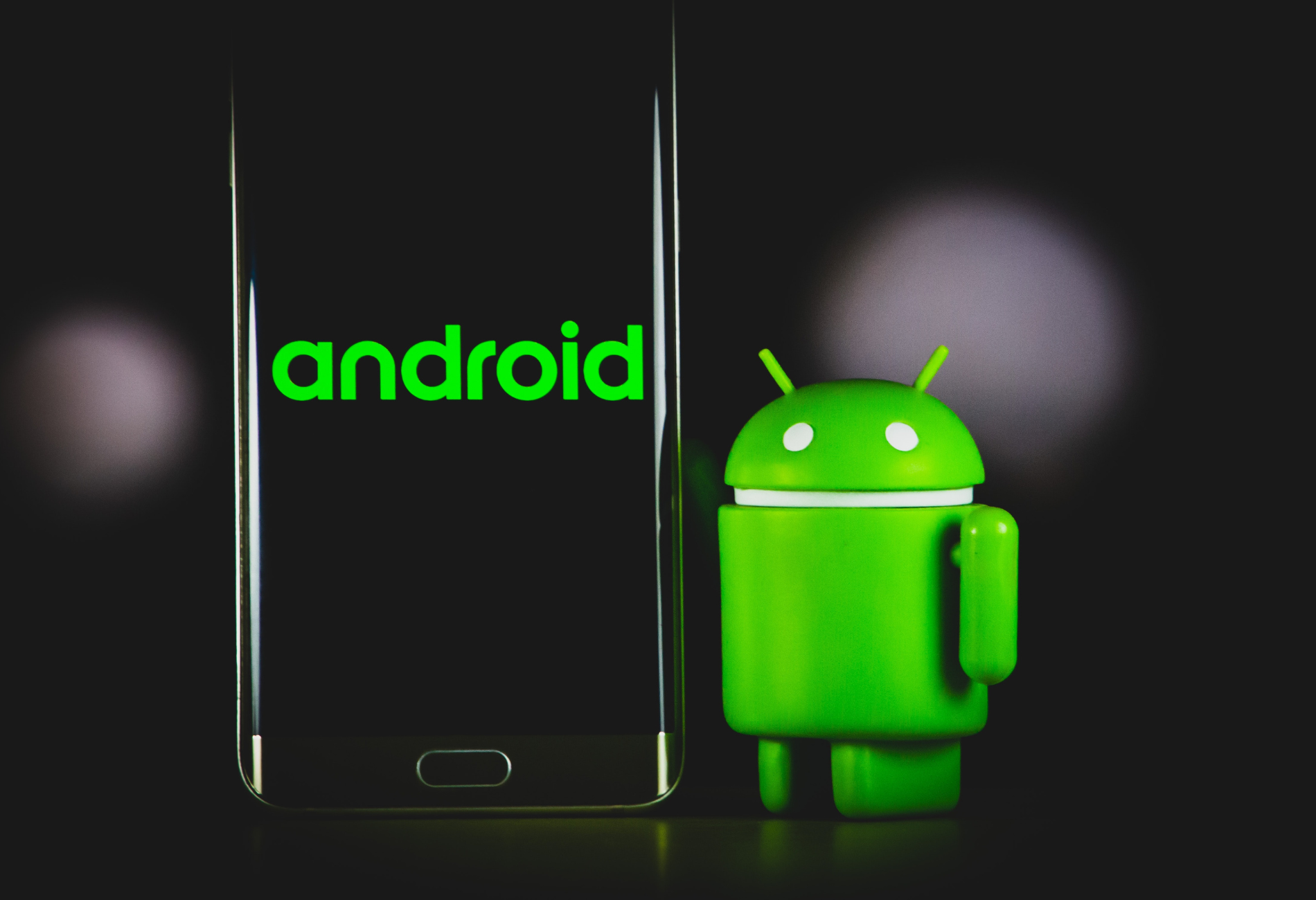 android logo next to a smartphone