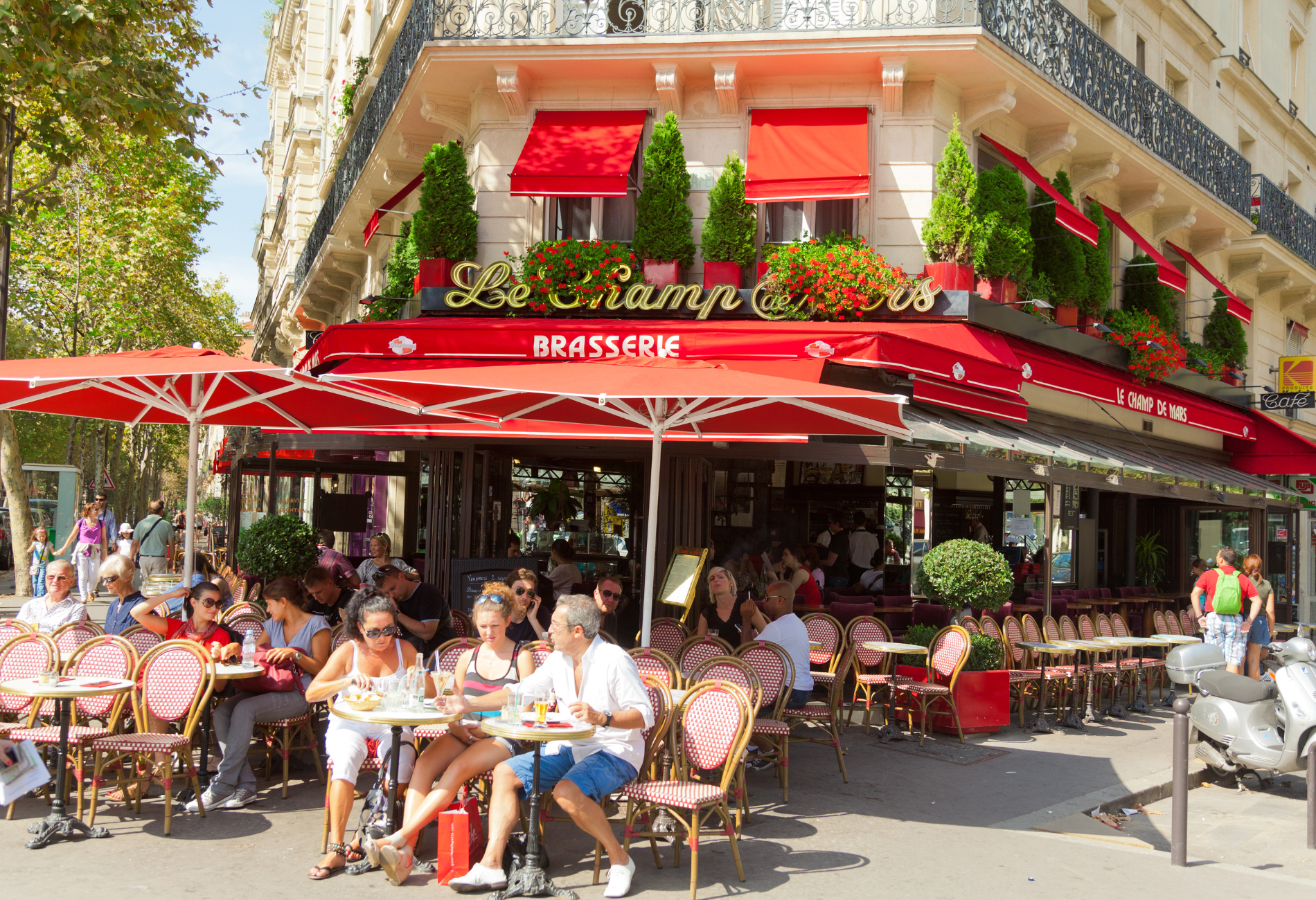 diners sit at a sidewalk cafe in paris