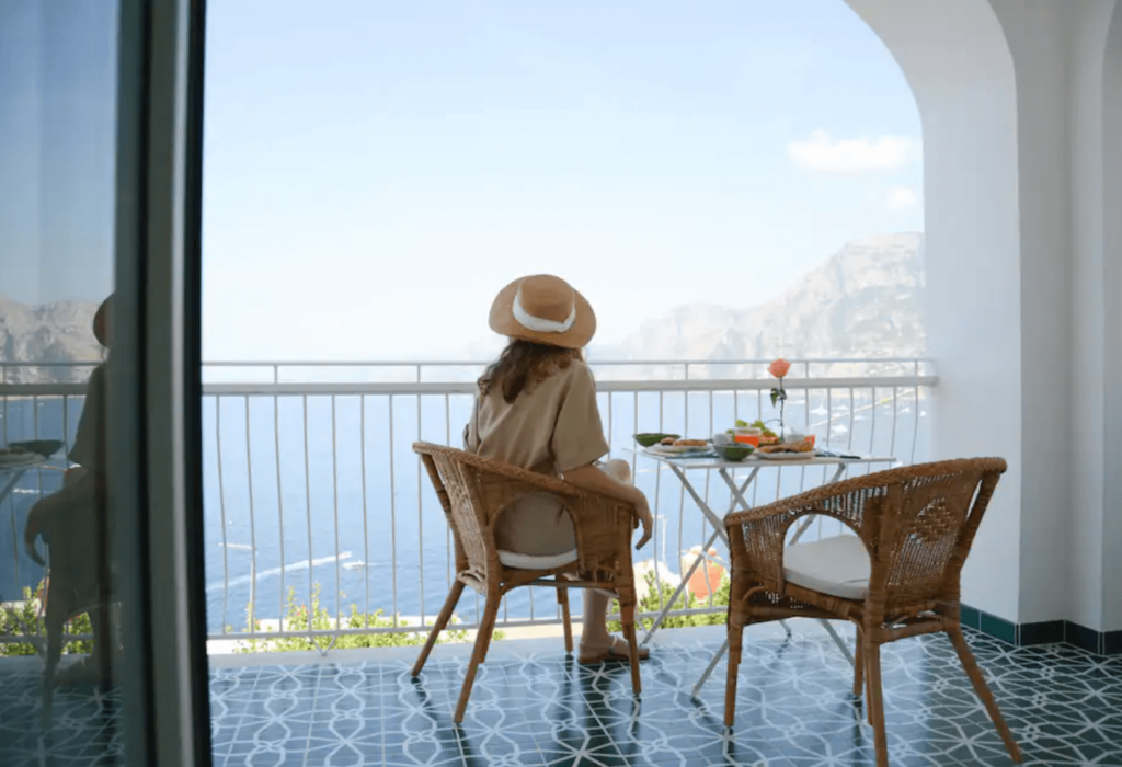 woman enjoying view of water on amalfi coast