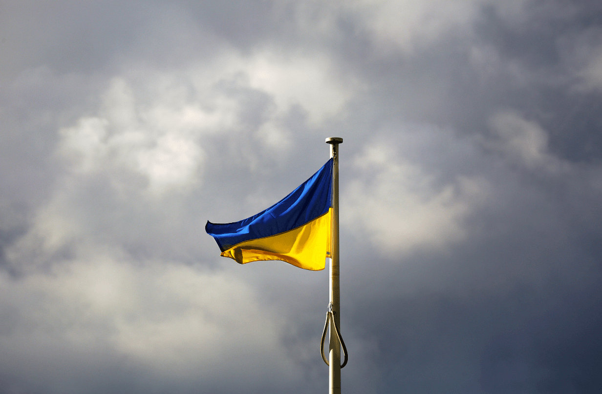 ukraine flag with stormy clouds