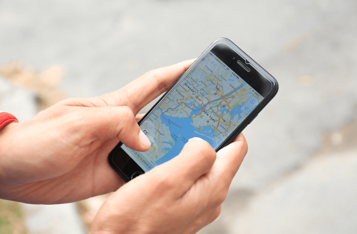 person searching maps on phone