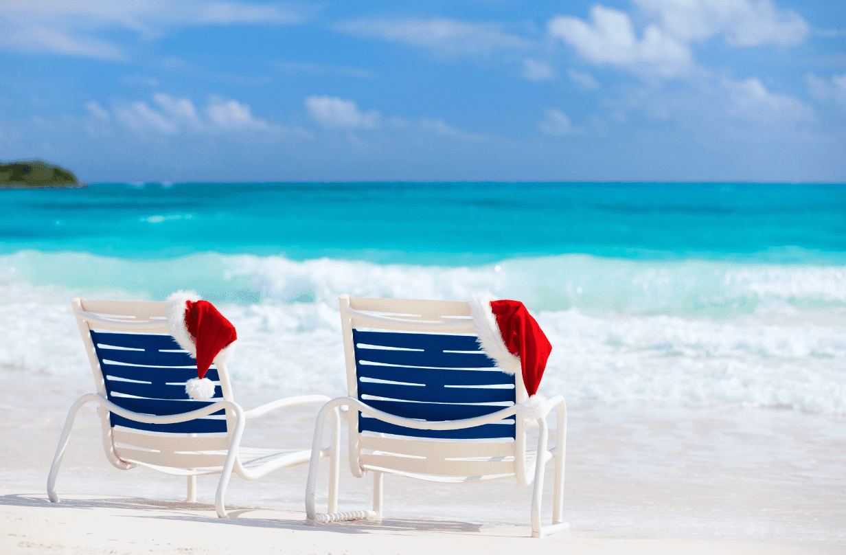 beach chairs with santa hats on them