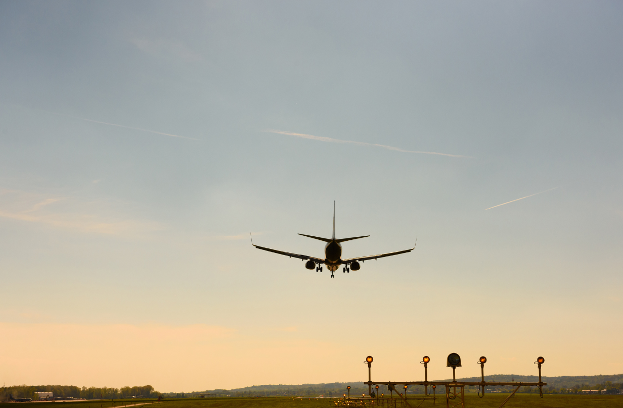 plane landing dusk sunset