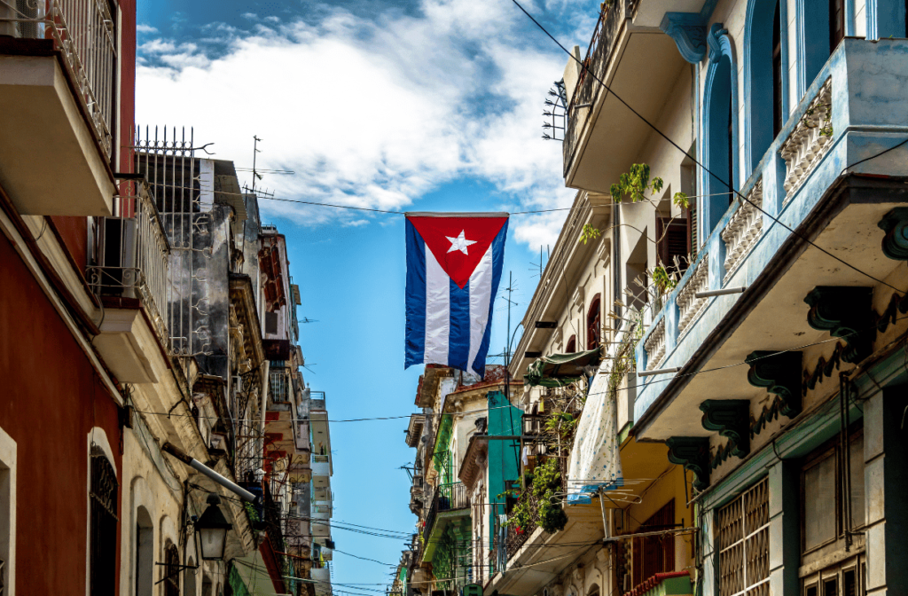 cuban flag hanging between buildings