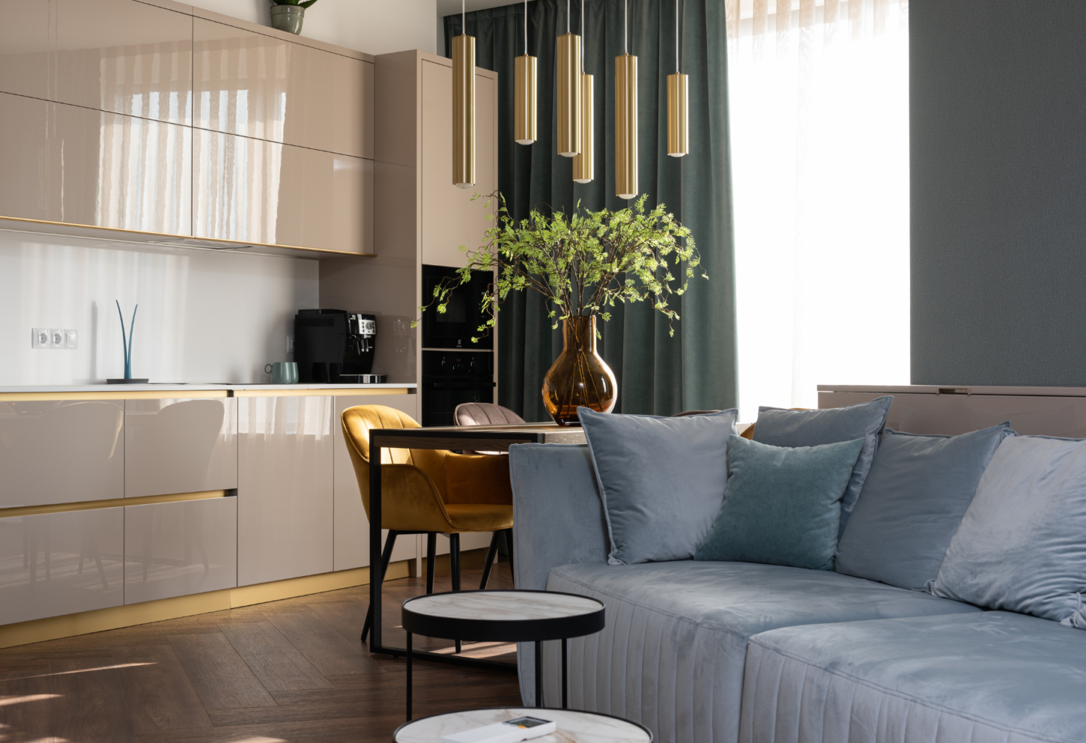stylish apartment interior with a couch and kitchenette
