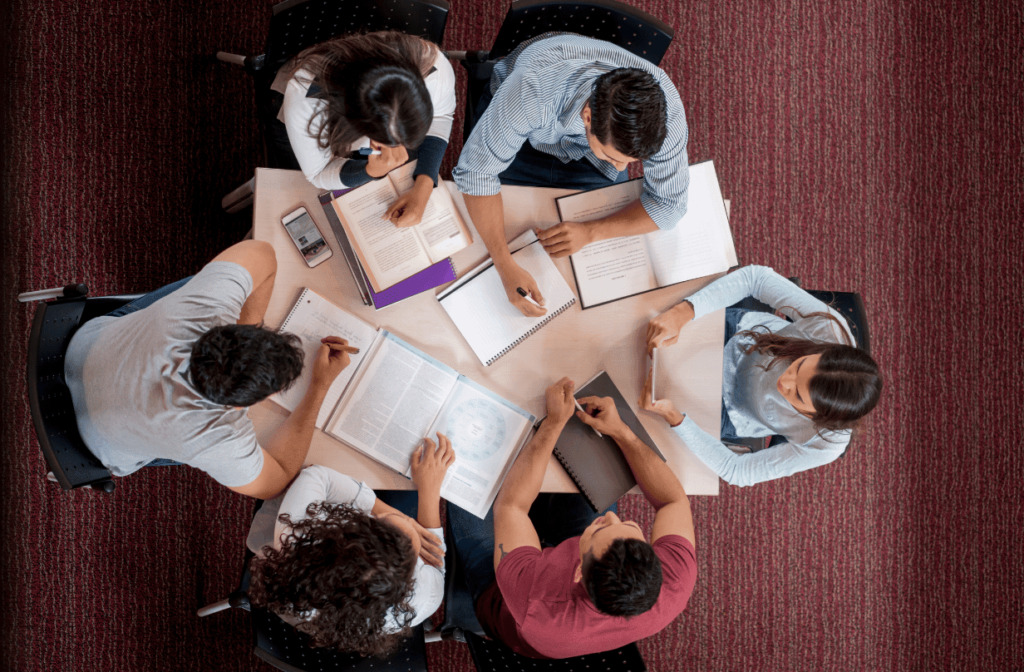 students studying around desk