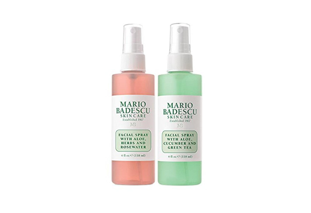two facial spray bottles, one pink and one green