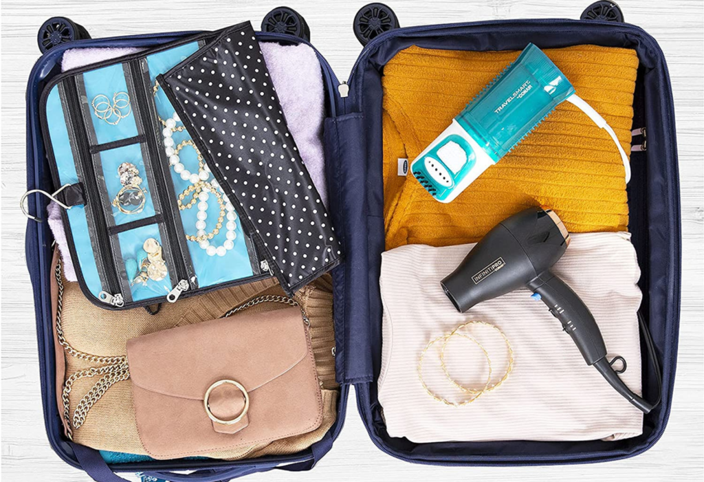 open luggage with clothing and accessories