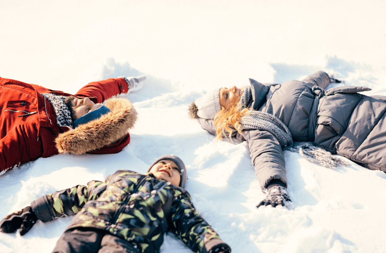 3 people making snow angels