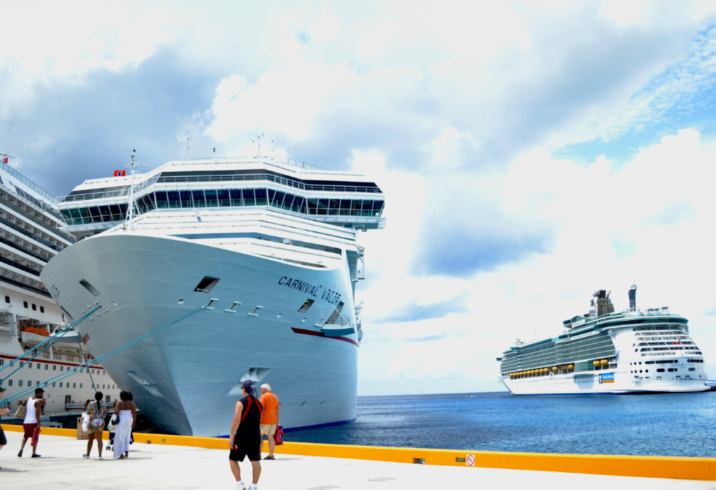 Carnival cruise line ship docked at a port