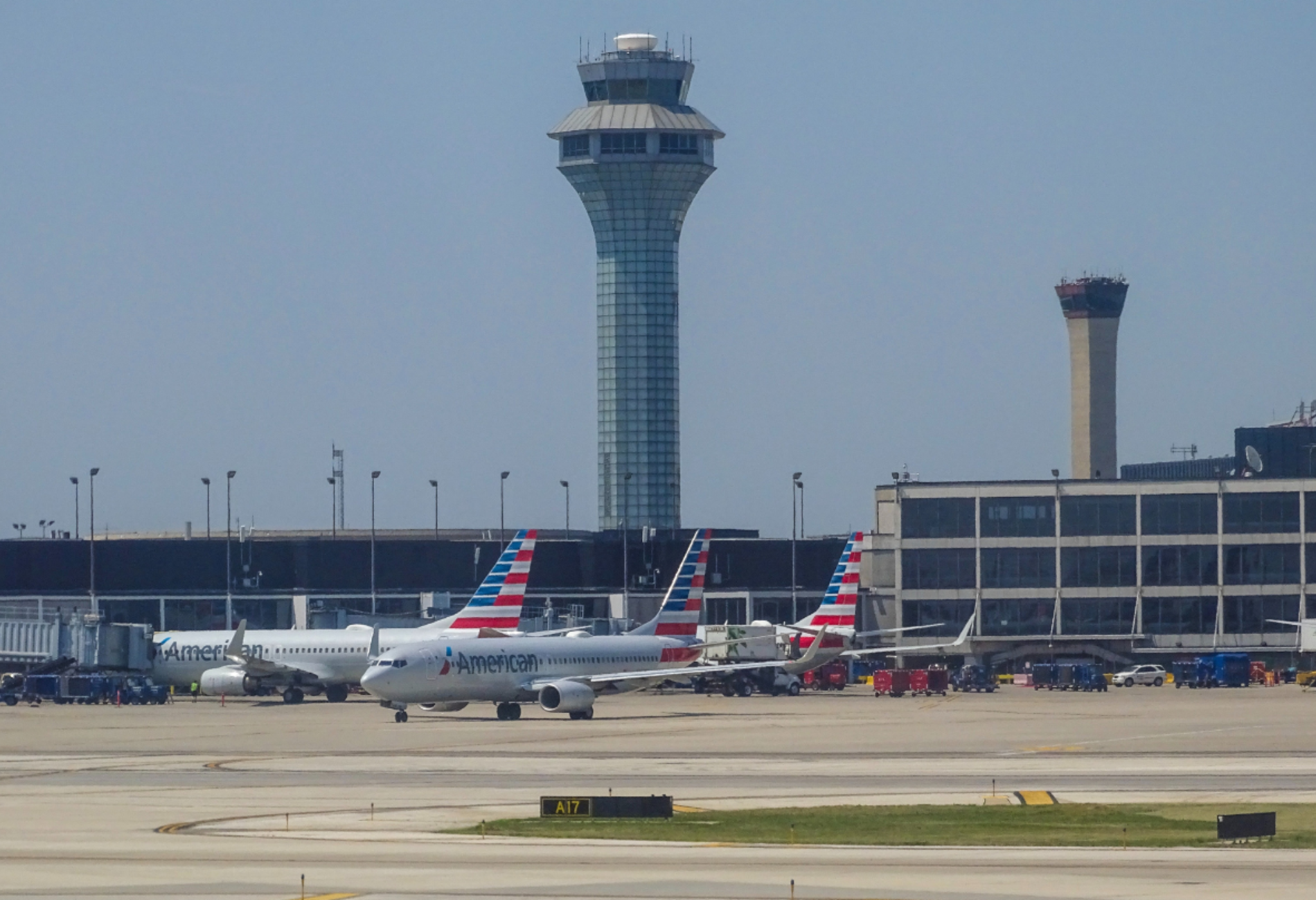 planes on tarmac and control tower in background