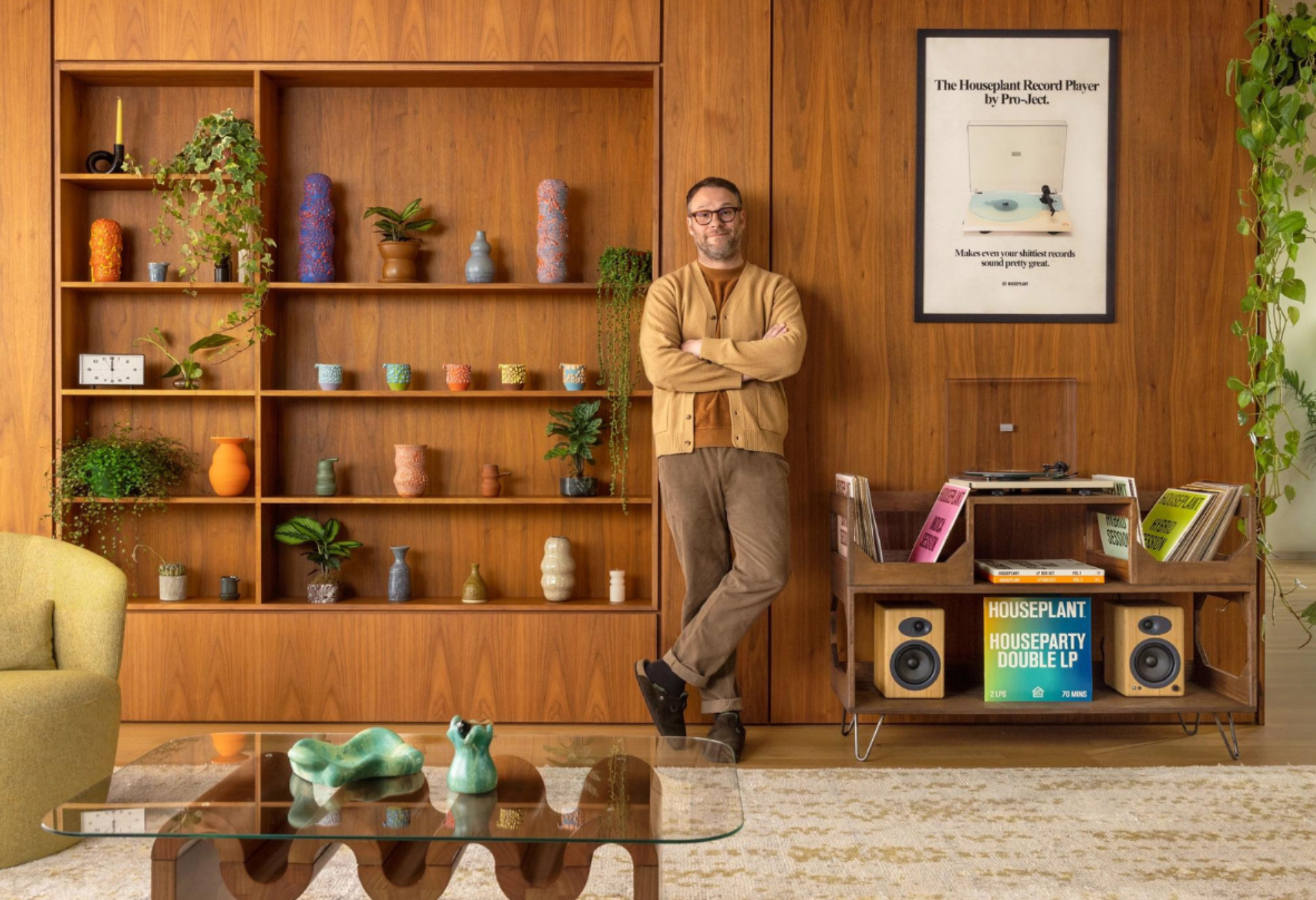 Seth Rogen standing in front of a wall with ceramics