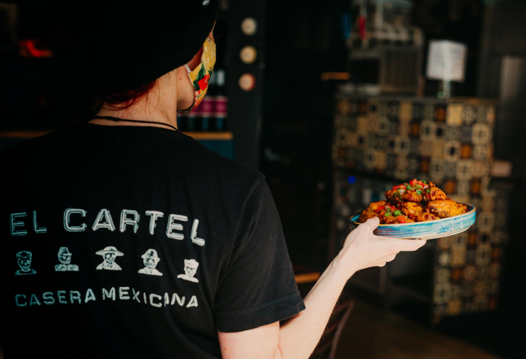 person holding a plate of food