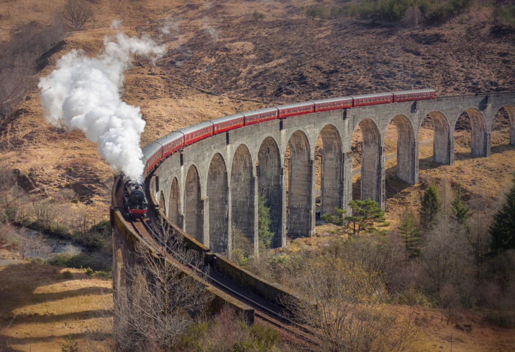 train moving through Scotland with visible smoke