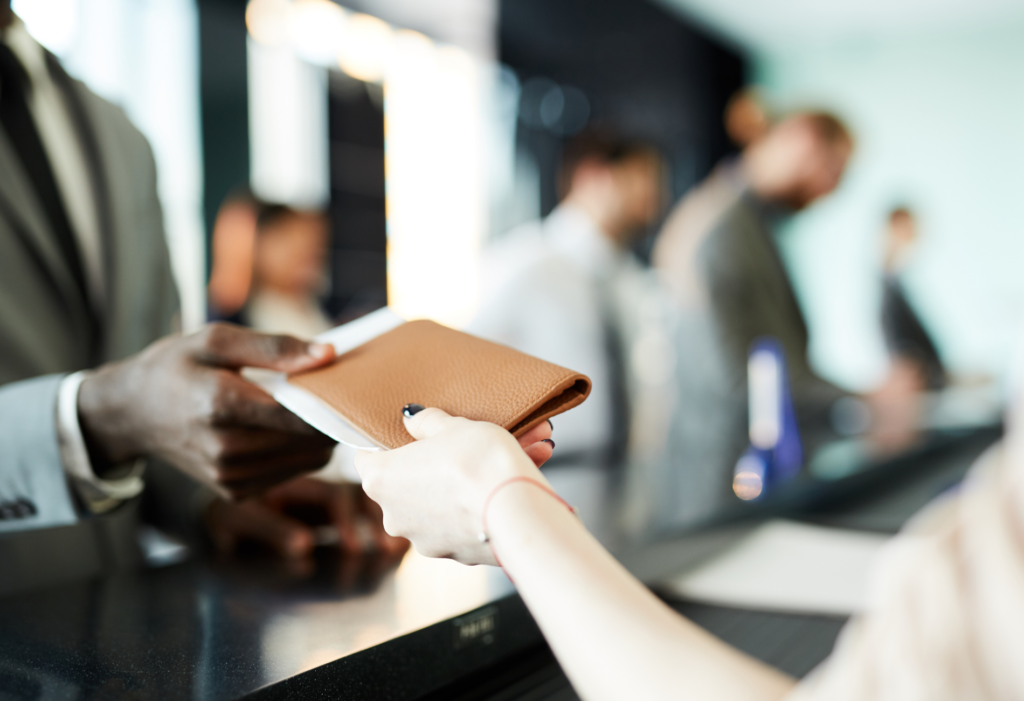 person handing over their passport