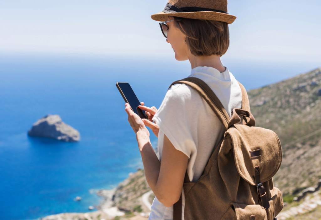 woman traveling holding phone