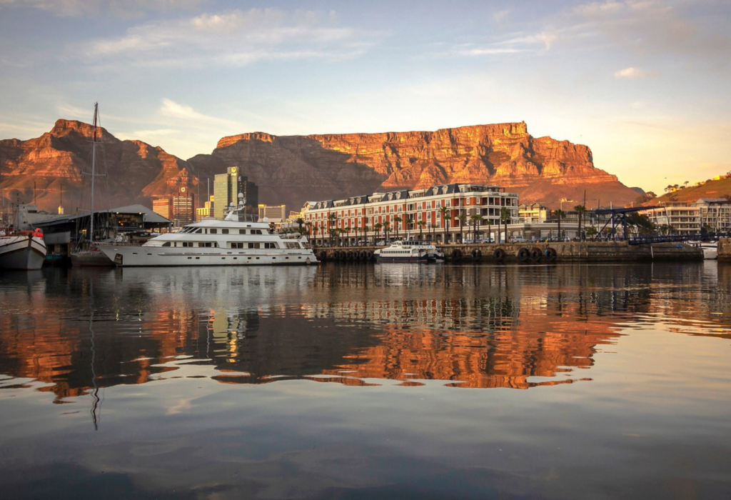 harbor just past sunset in Cape Town, with yacht and hotel in view