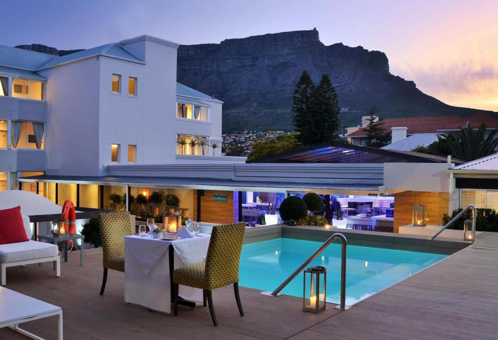 pool, hotel, and a mountain in the back