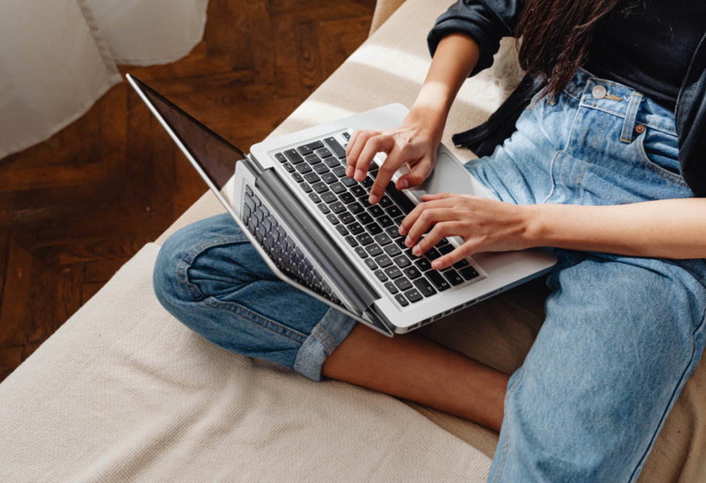 woman on laptop for article on Tripadvisor
