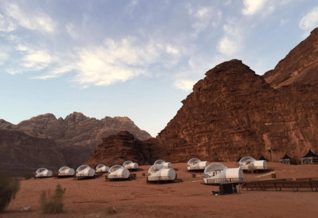 Wadi Rum Luxury Camp with cliffs behind