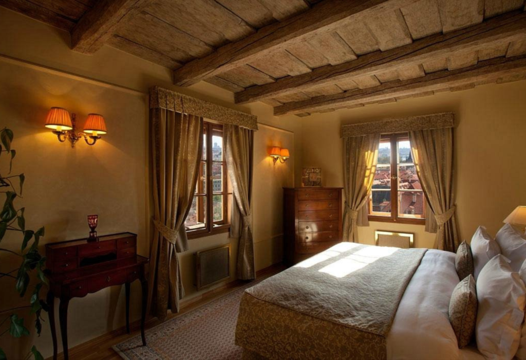 rustic hotel room in Prague with low ceilings and views to outside