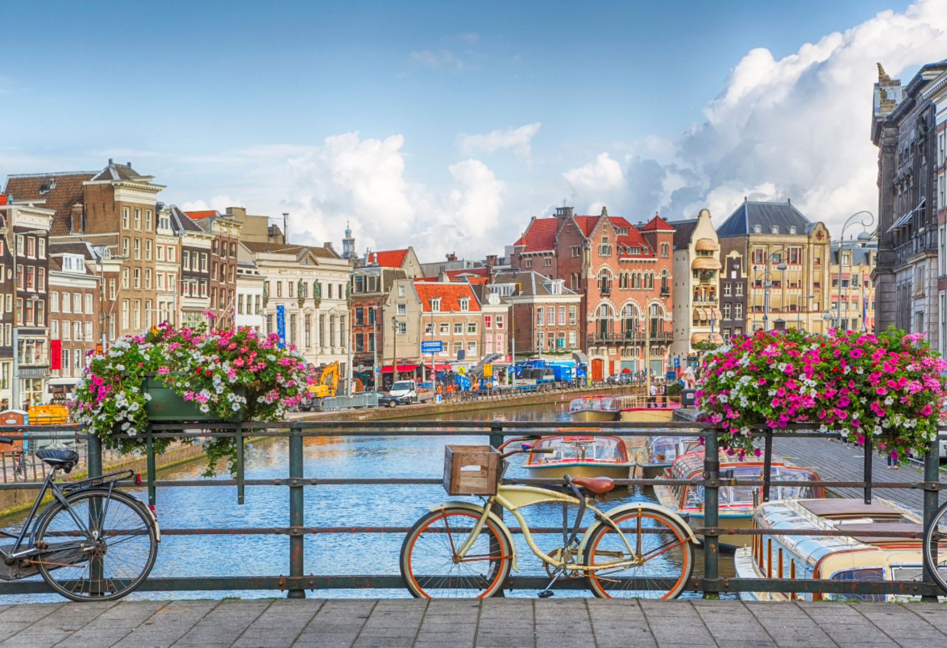 city of Amsterdam with colorful buildings, river, and a bike