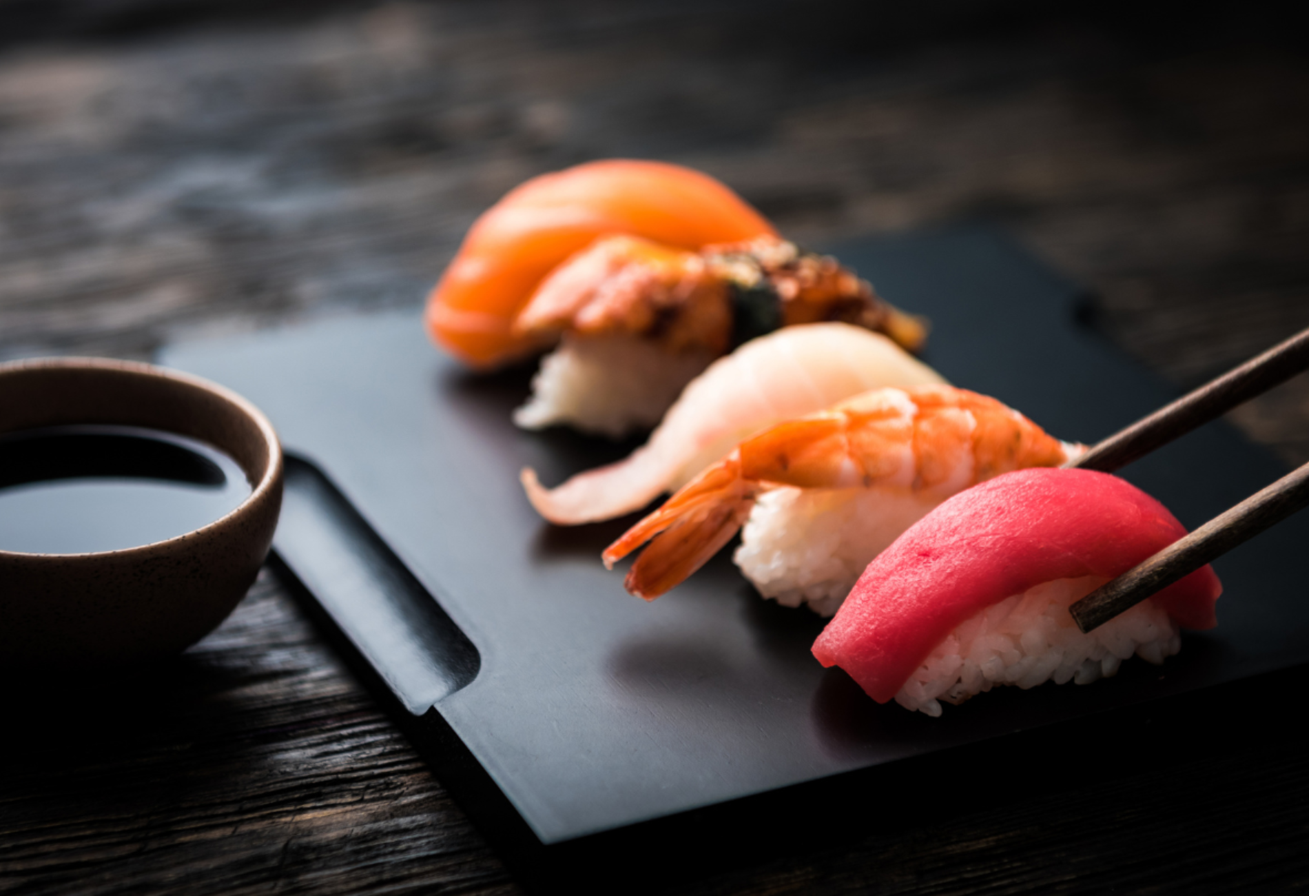 sushi and chopsticks with soy sauce