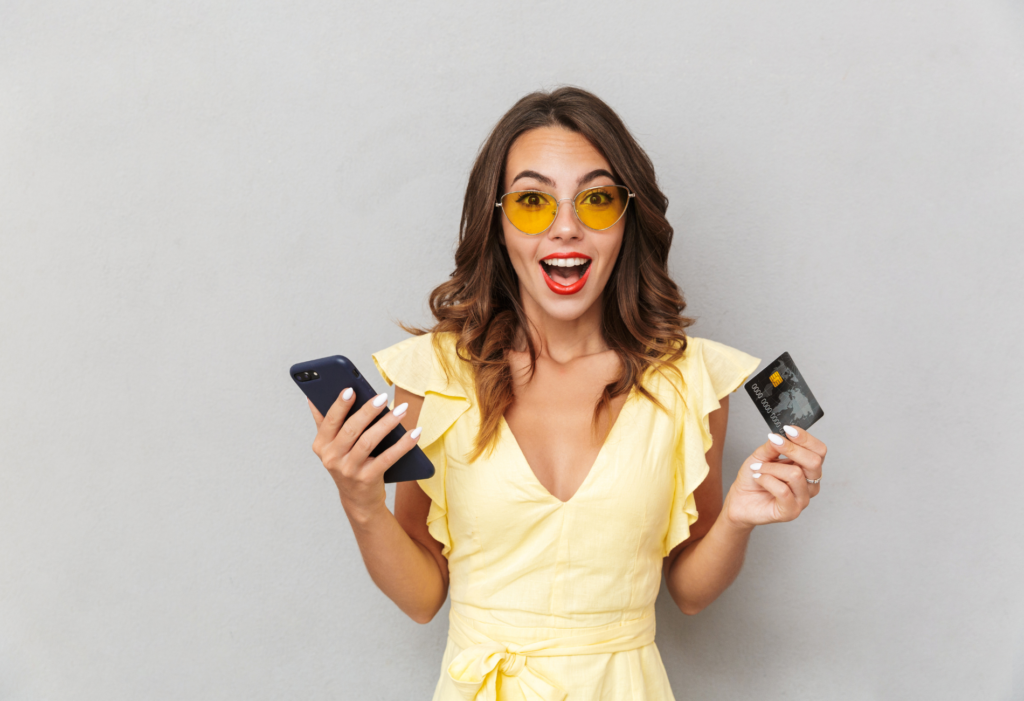 Credit card art, woman with yellow dress holding a phone and a credit card