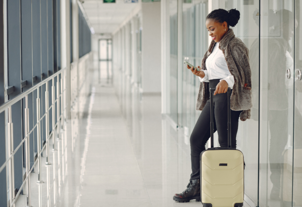 woman with phone at airport