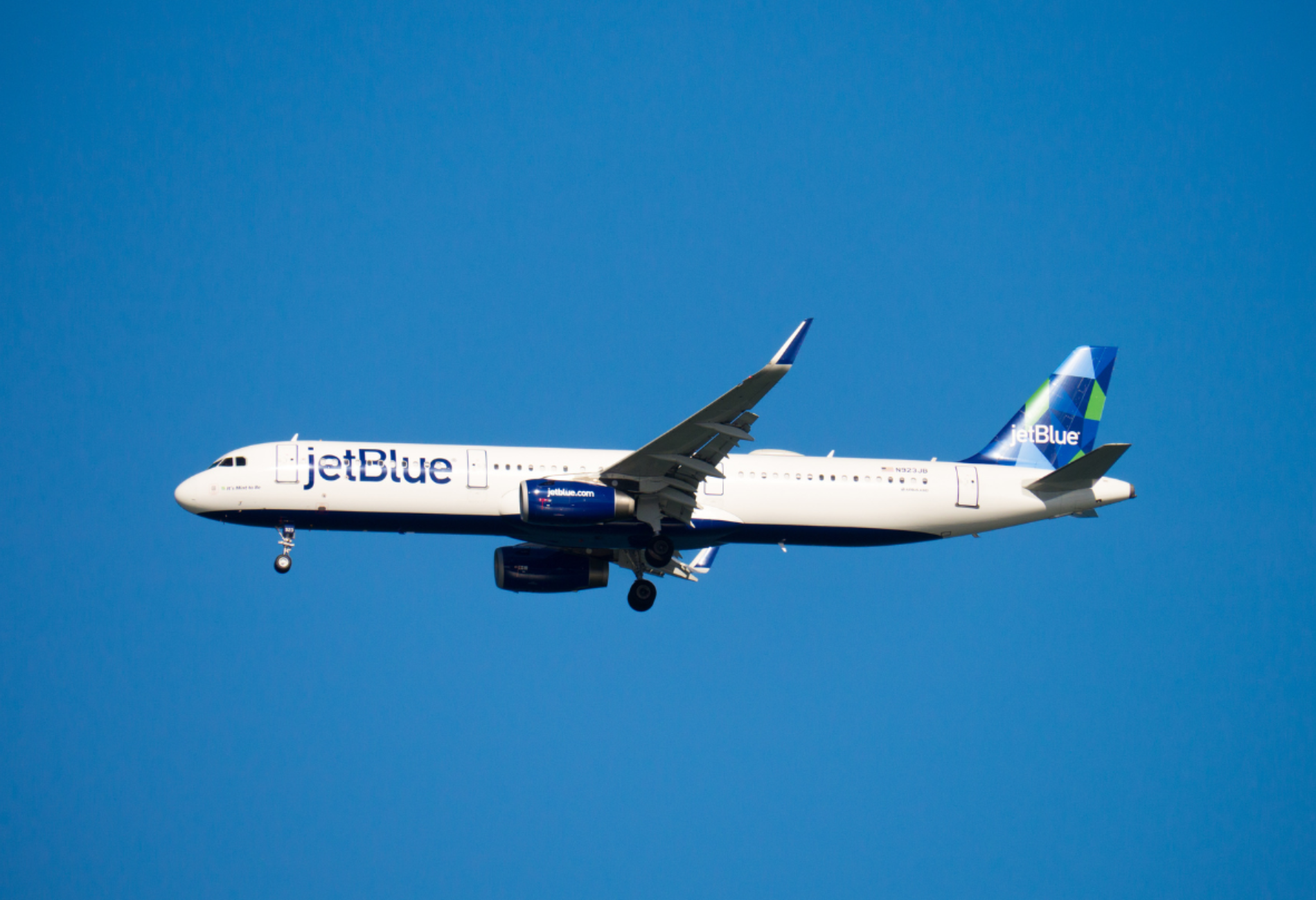 JetBlue plane in sky for story on jetblue sale