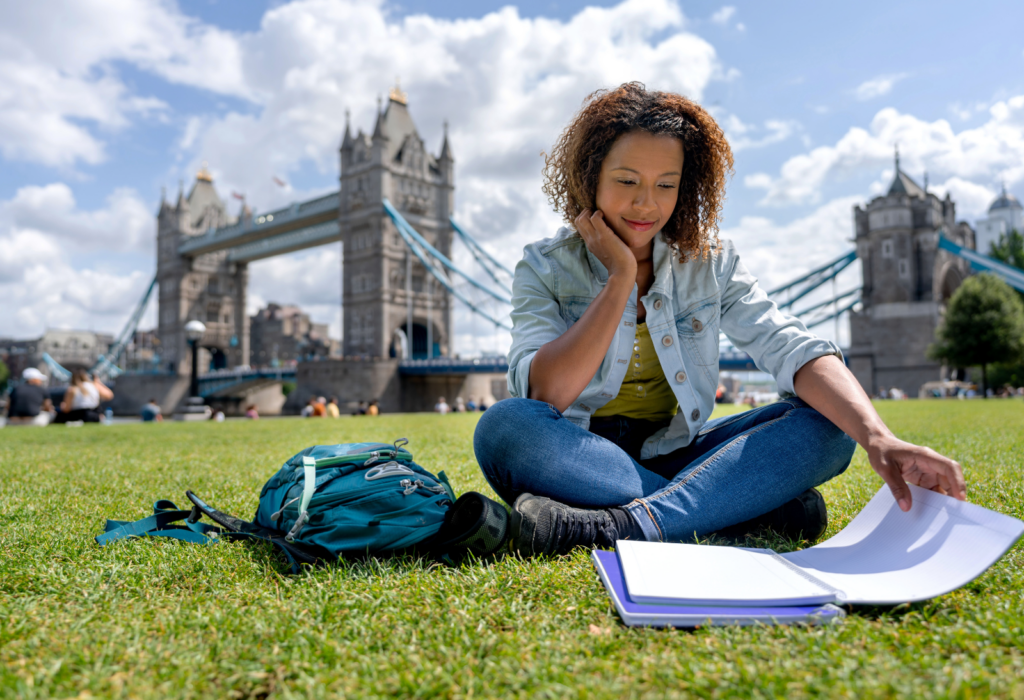 woman studying in london on grass