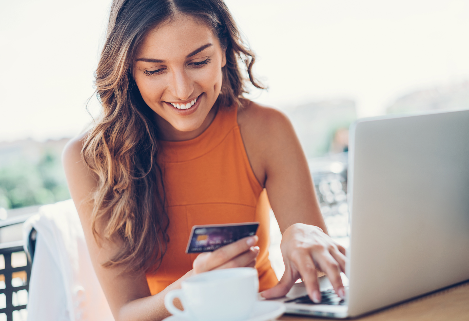 woman with credit card and laptop