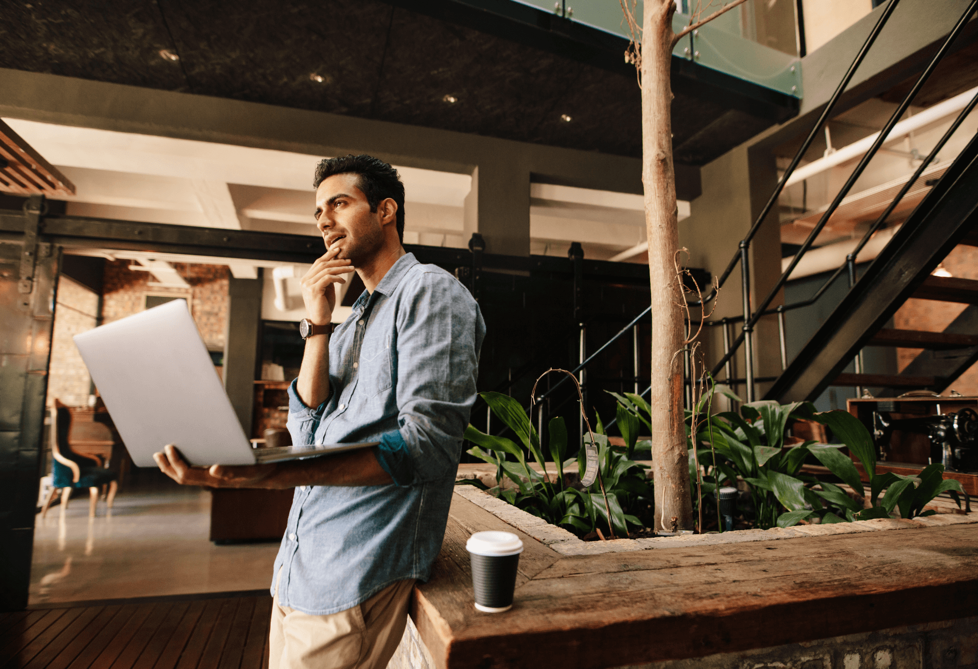 man with laptop in hotel