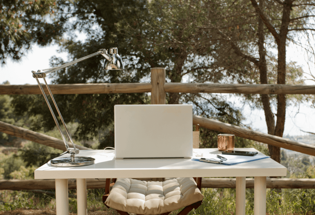 title picture of laptop on a table outside