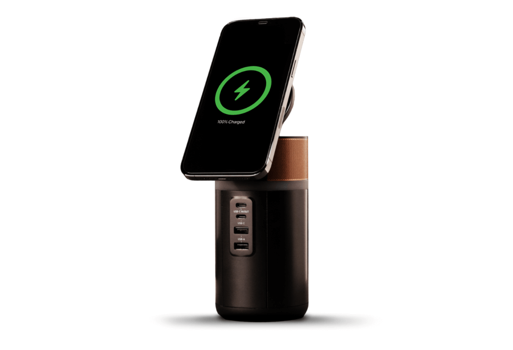 the duracell m150 portable powerstation charging a phone wirelessly
