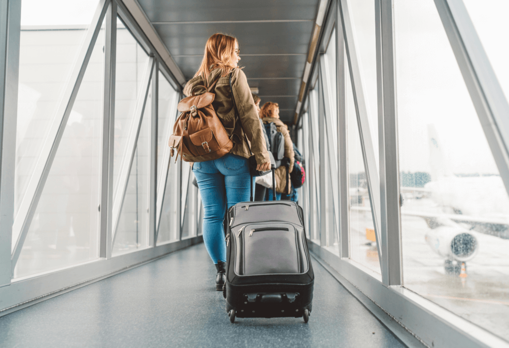 person with luggage in airport