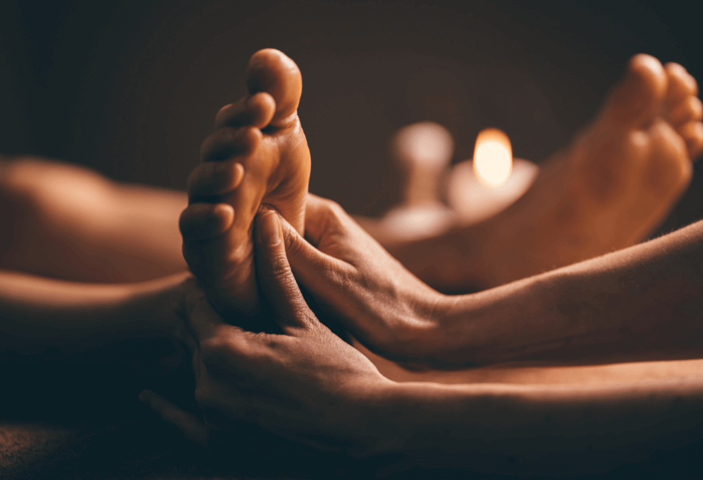 a woman recieiving a foot massage at a spa resort