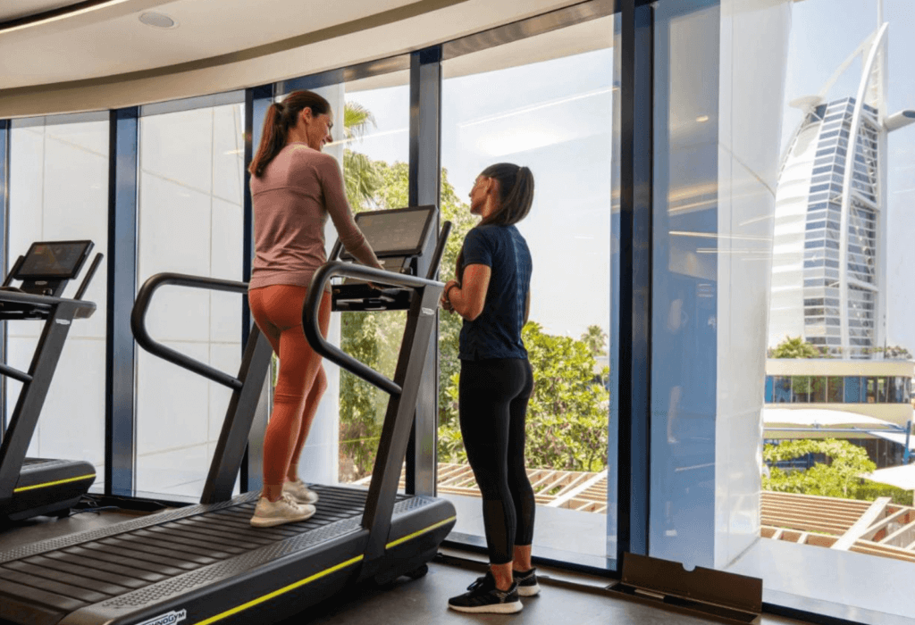 a trainer advises a client at the hotel gym at Jumeirah Beach Hotel in Dubai