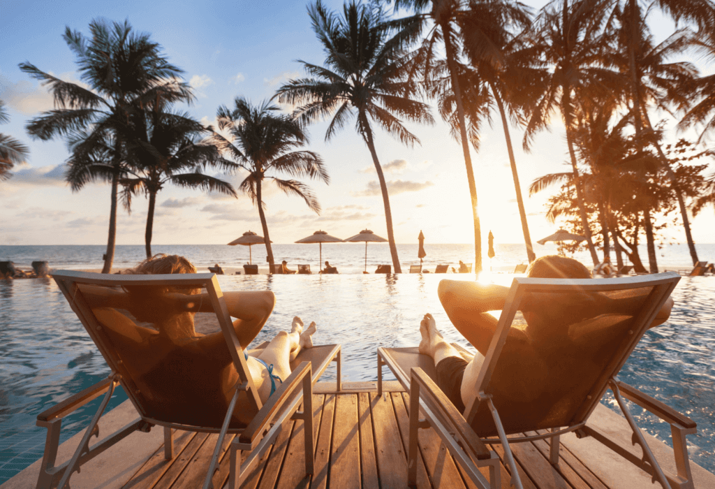 couple lounging on chairs by the pool The Best Romantic Hotels Near Me