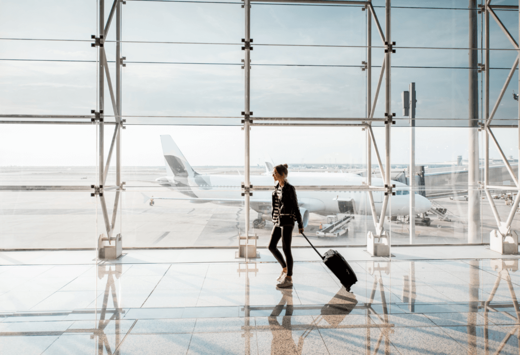 person walking through airport for story on jetblue sale