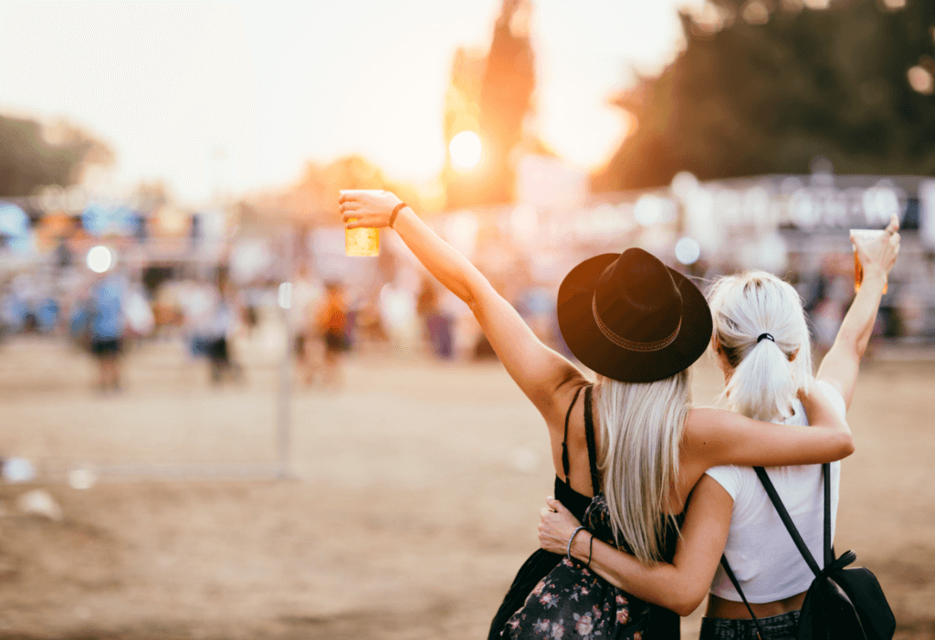 two women enjoying beer at music festival for story on how to win Stagecoach tickets