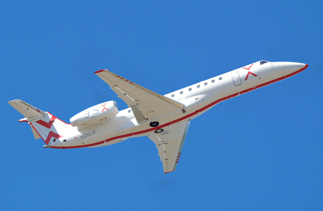 JSX plane in sky for story on how to win a free flight with JSX to see the 2024 solar eclipse