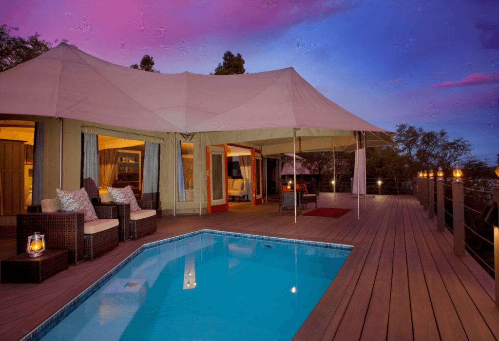 the outside of Hippo Lakes' glamping tents in South Africa with pool
