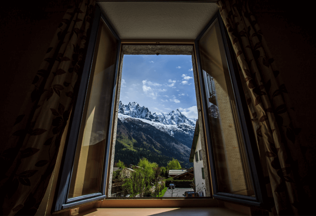 View from a hotel window out onto mountains