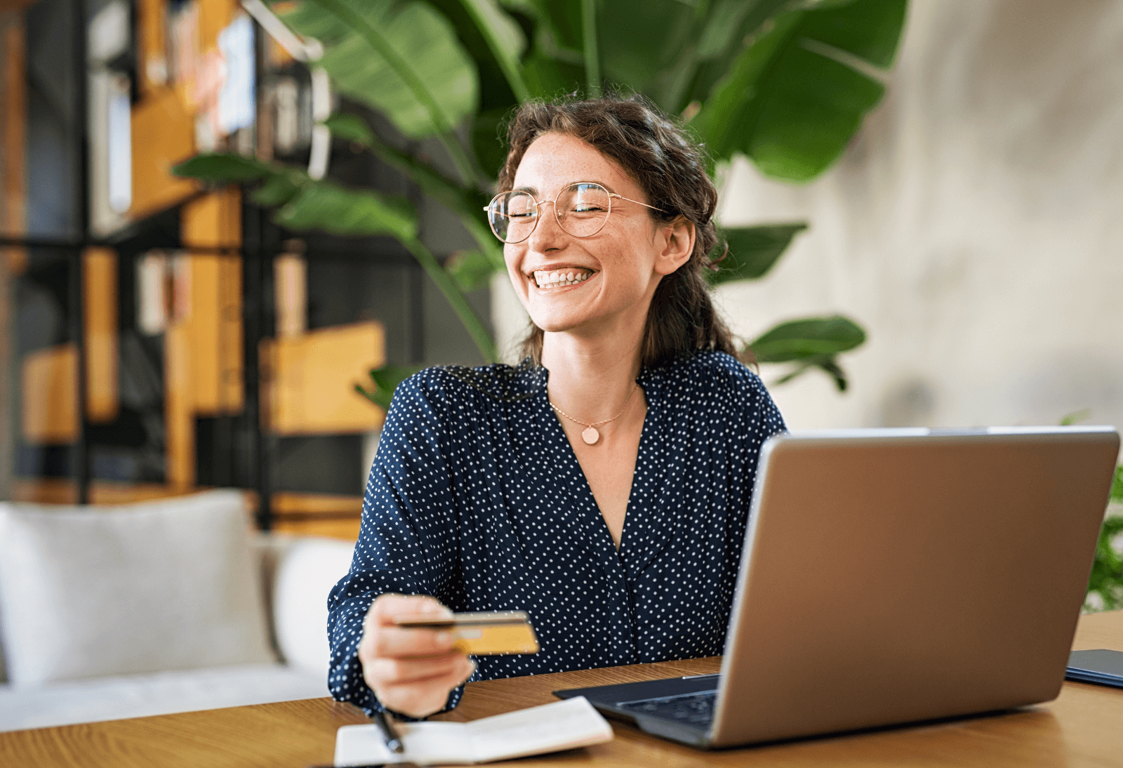 woman with credit card and laptop