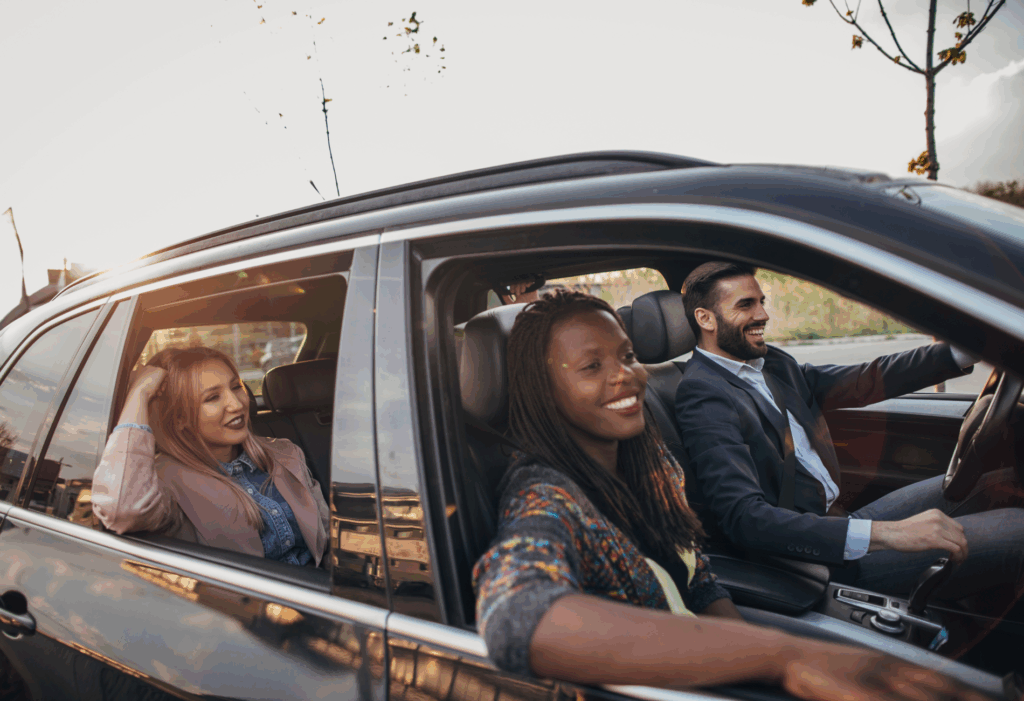 four friends driving in a car together