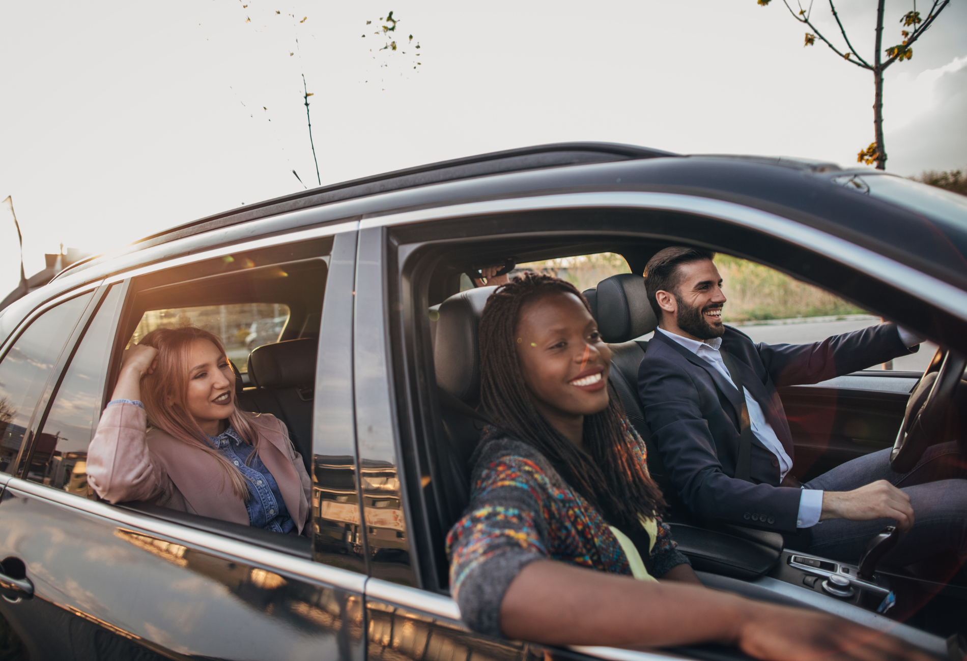 four friends driving in a car together